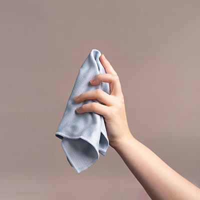 Removing dust from a canvas with a cloth